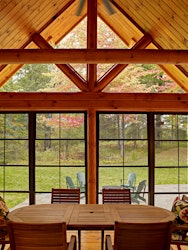 Three-season porch at Beaver Mountain Log Home