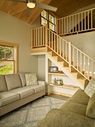 Built-in under-stair storage at Salmon Ledge Cottage
