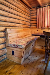 Built-in dining banquette in a log cabin
